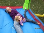Playing in the bounce house with my granddaughter.